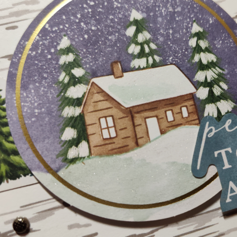 Detail of the card, showing the glittery effect on the snow