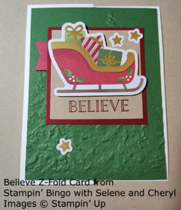 Z-fold card with a present-filled sleigh and the sentiment Believe