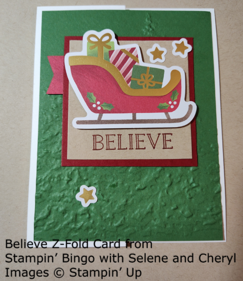 Z-fold card with a present-filled sleigh and the sentiment Believe