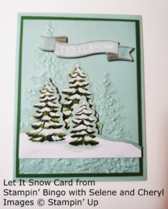 Card showing pine trees with glittery snow and the sentiment Let It Snow