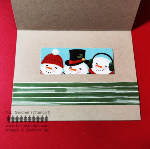 Inside of the card showing a horizontal light brown pocket for a gift card, decorated with a strip of green and white striped paper